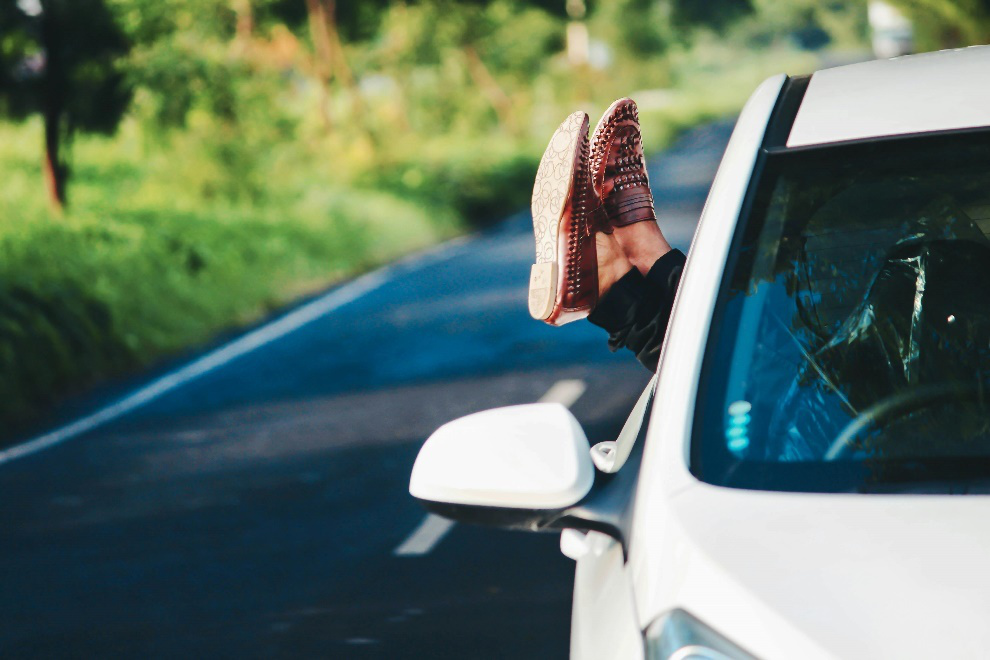 Brown shoes outside a car