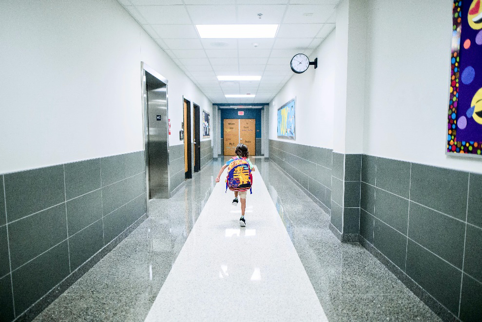 Boy running in a corridor