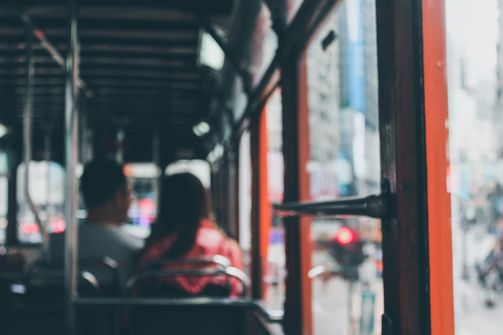 Commuters sitting inside a bus